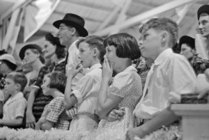 Russell Lee - Group of people watching magician, state fair, Donaldsonville, Louisiana, 1938